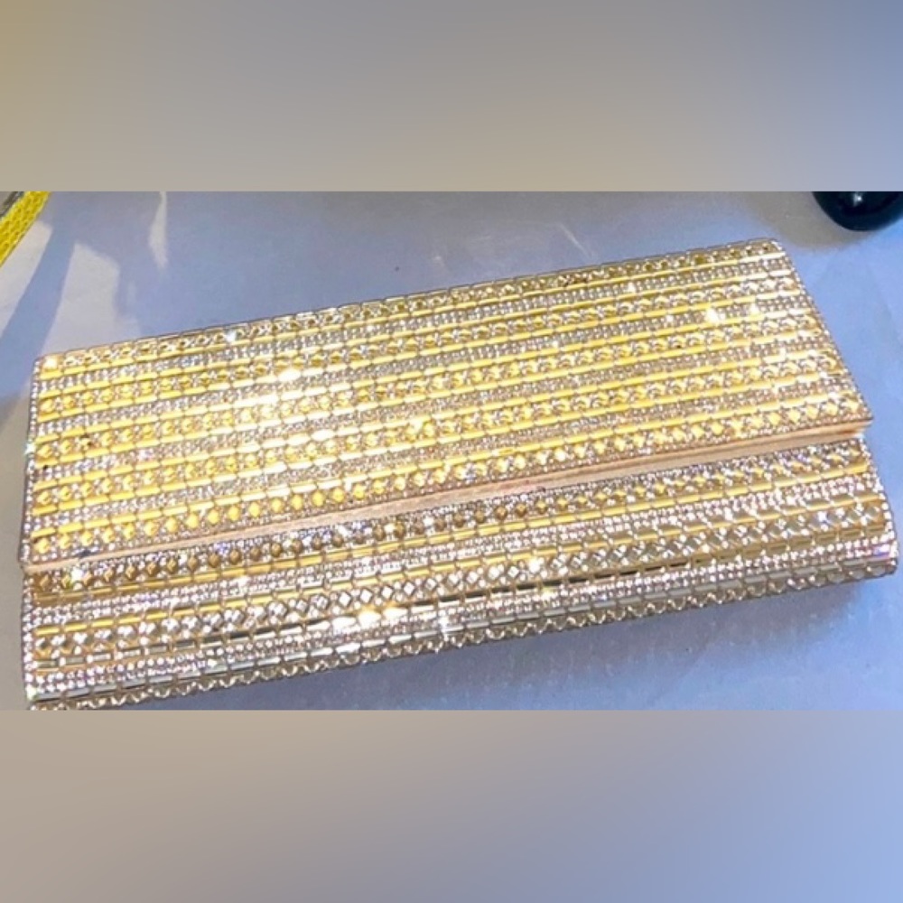 Classy gold and crystal clutch. Dress up or dress down!-Aldo